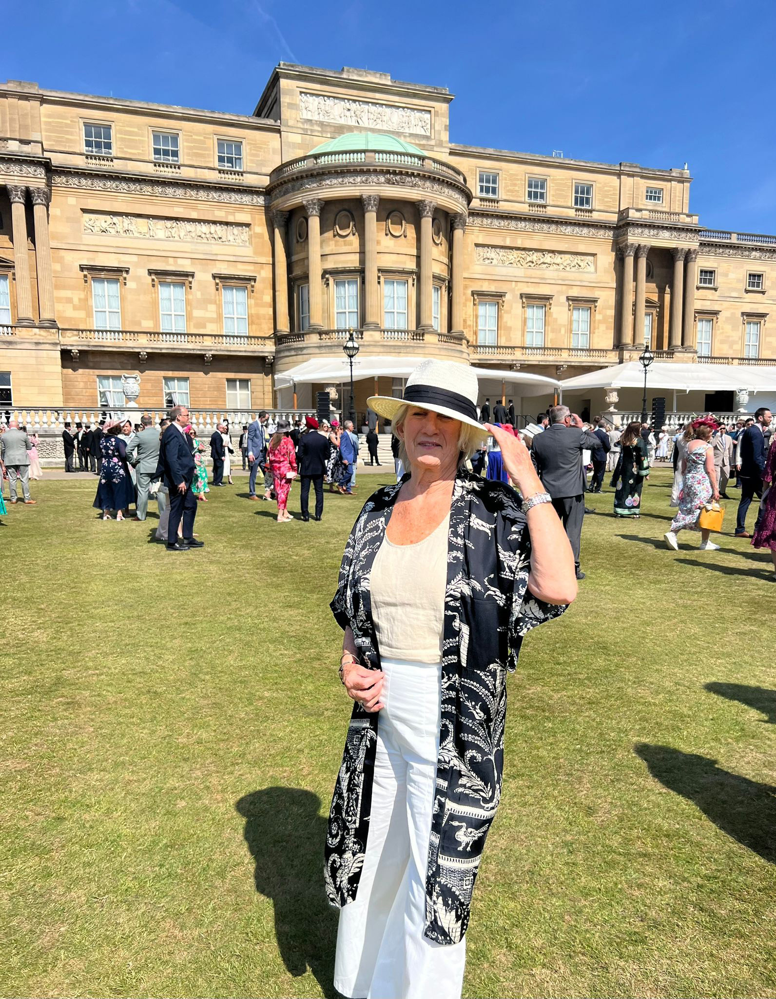 Jo standing in the garden of Buckingham Palace